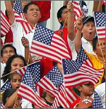 crowd waves US flags