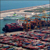 container ship at port surrounded by containers