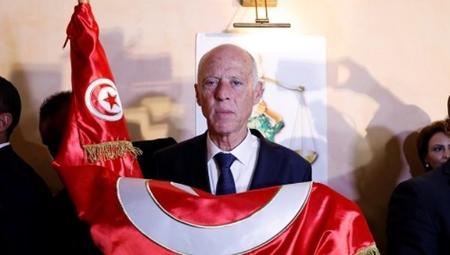Kais Saied with Tunisian flag